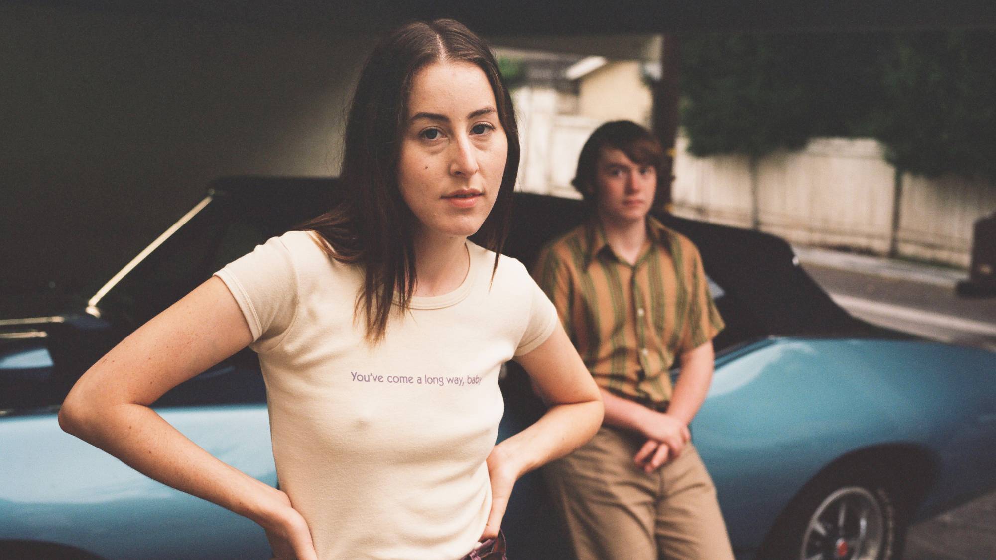 (L-R) Alana Haim as Alana Kane and Cooper Hoffman as Gary Valentine in "Licorice Pizza" now streaming on Prime Video