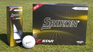 The Srixon 2021 Z-Star golf balls in and out of packaging, srixon golf ball with grass background
