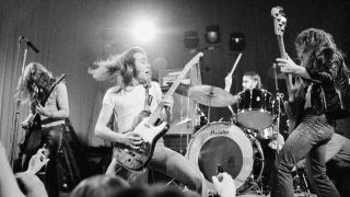 Status Quo performing onstage in 1973