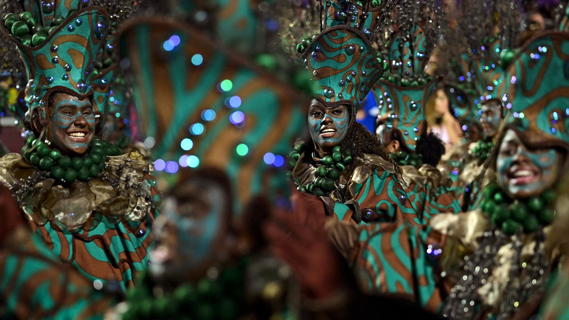 
                                Revellers perform during the opening night of the Rio Carnival in Rio de Janeiro, Brazil
                            