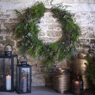 brick wall with wreath and lantern