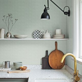 Small check wallpaper in kitchen with white shelf