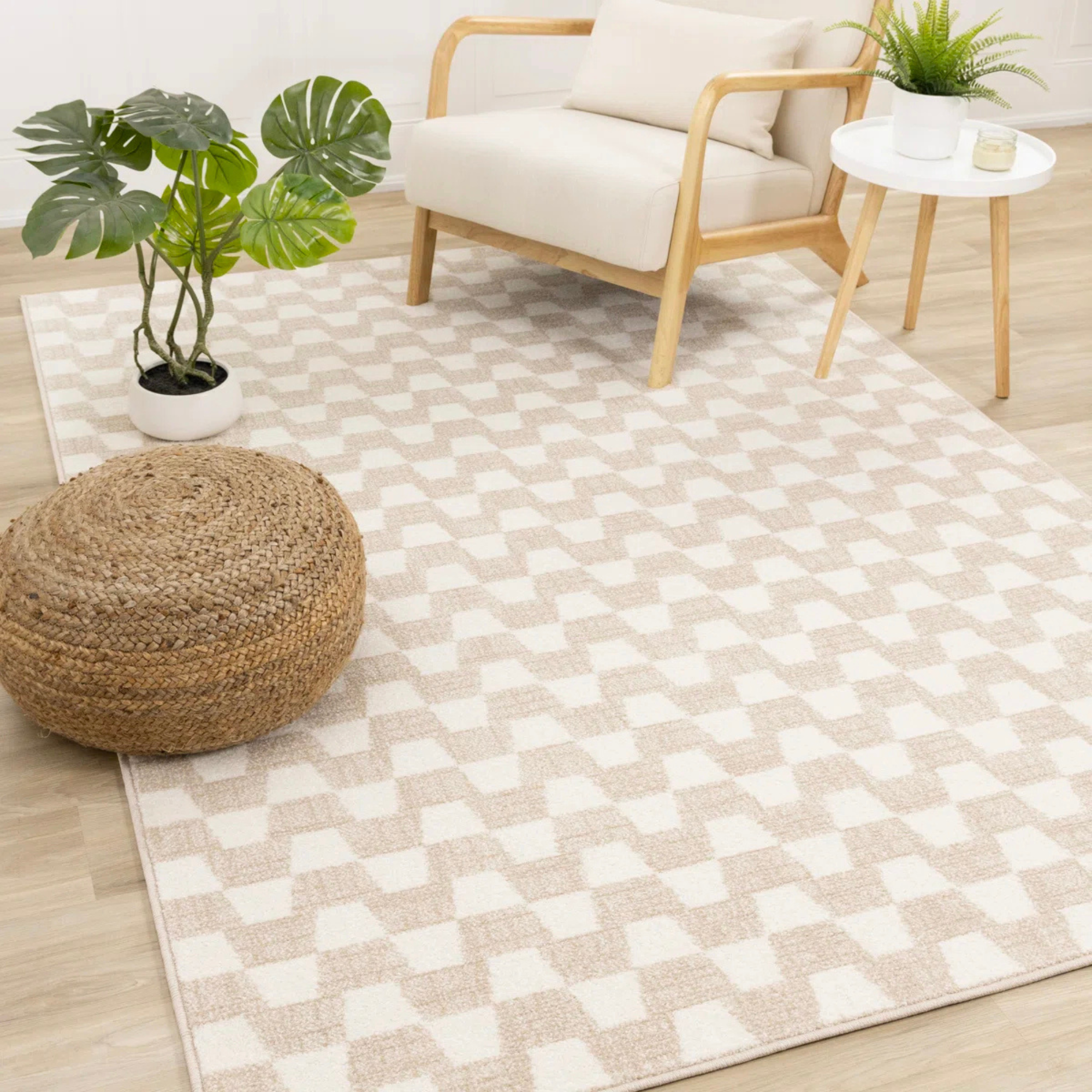 A patterned beige and white rug from Wayfair
