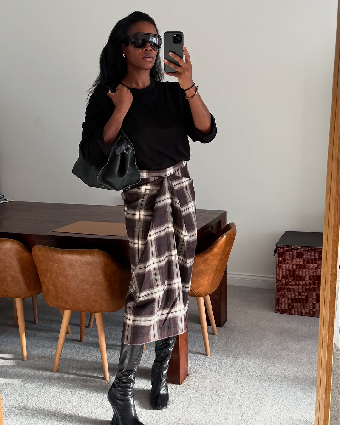 woman wearing fall skirt outfit 2025