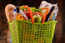 supermarket basket with wine and groceries