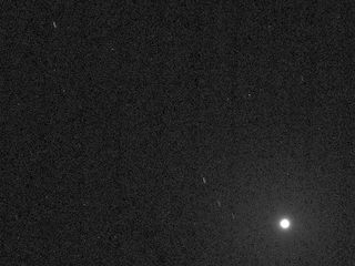 The brightest object in this image, taken by NASA's Curiosity rover, is the Martian moon Deimos. The asteroids Ceres and Vesta appear as short faint streaks in the upper half of the image, which marks the first time that asteroids have been photographed from the Martian surface.