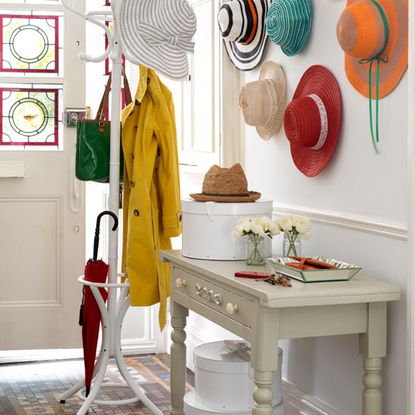 hallway with cream colour wall and colorful caps