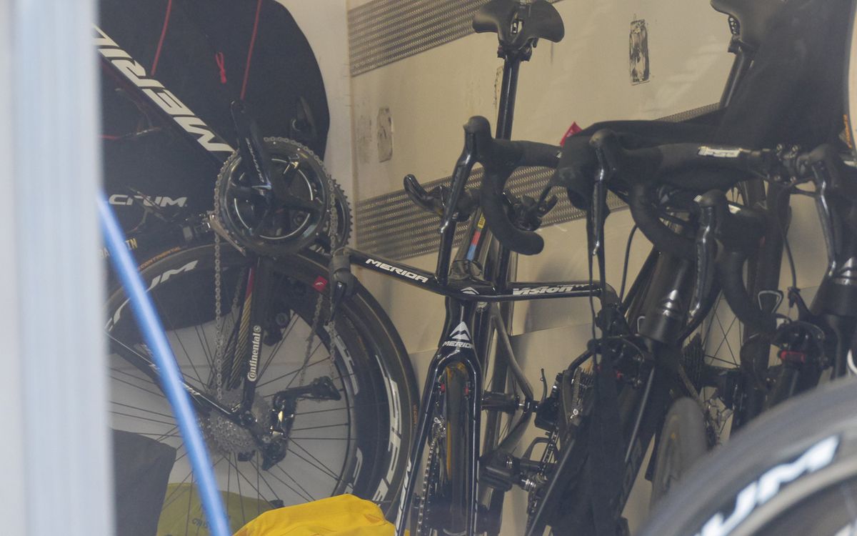 Rohan Dennis' TT bike in world champion colours was sat at the back of the Bahrain-Merida bus unused