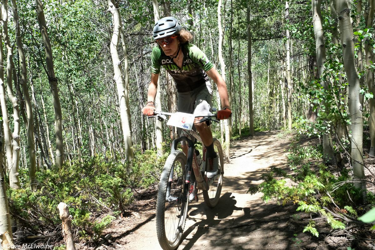 Scott McCalmon riding through an aspen grove in French Gulch