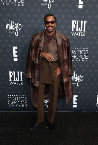 Colman Domingo wears a brown outfit at the Critics Choice Awards.