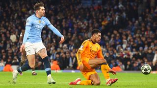 Jude Bellingham of Real Madrid scores his side's third goal during the UEFA Champions League 2024/25 League Knockout Play-off first leg match between Manchester City and Real Madrid C.F. at Manchester City Stadium on February 11, 2025 in Manchester, England.