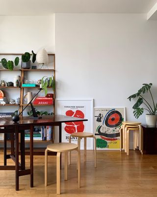 A living room with a set of stackable stools used as a side table