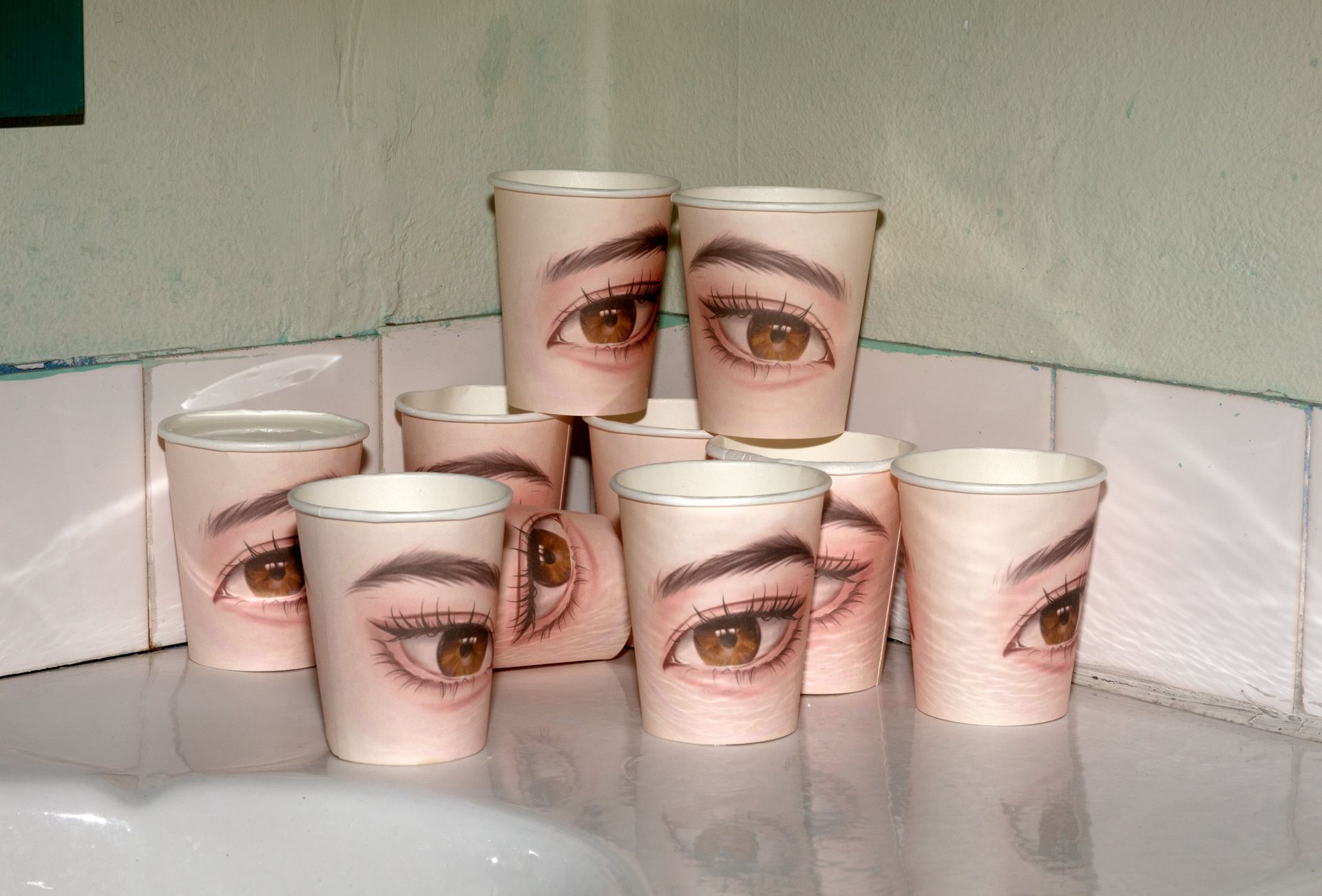 cups with images of eyes on