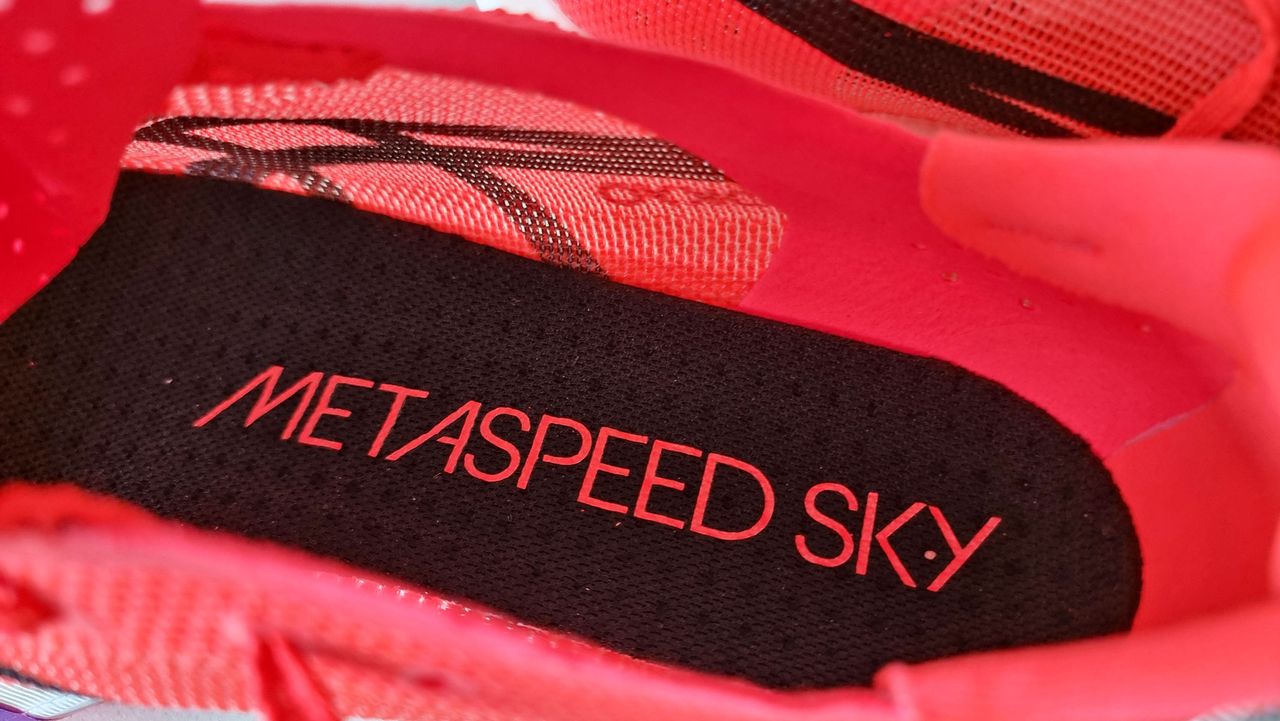 A picture of our reviewer's Asics Metaspeed Sky Tokyo running shoes