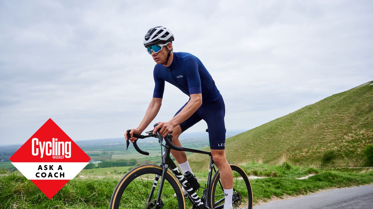 Male cyclist riding out the saddle