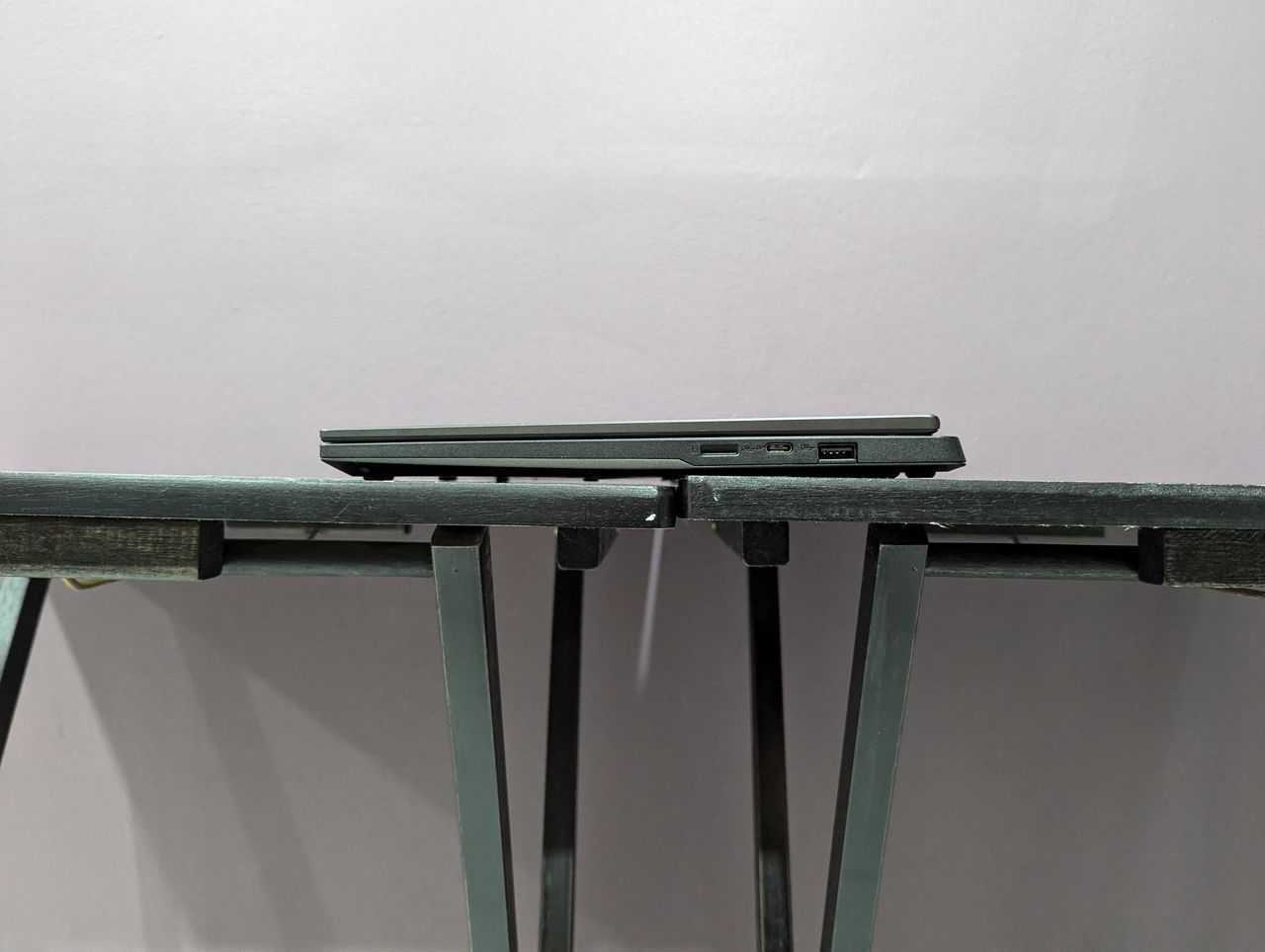 The right-side ports on the Asus TUF Gaming A14, sitting on a black desk.