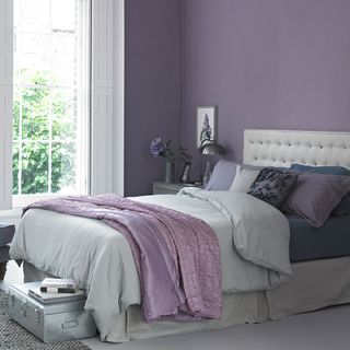 bedroom with purple wall and bed