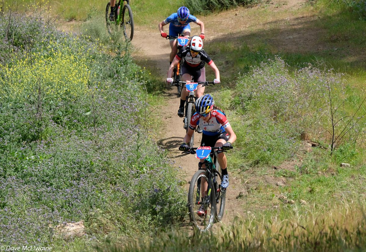 Kate Courtney (Specialized) leading a select group up the backside climb during lap one