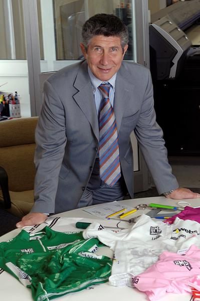 Pietro Santini displays jerseys he's made for the Giro d'Italia.