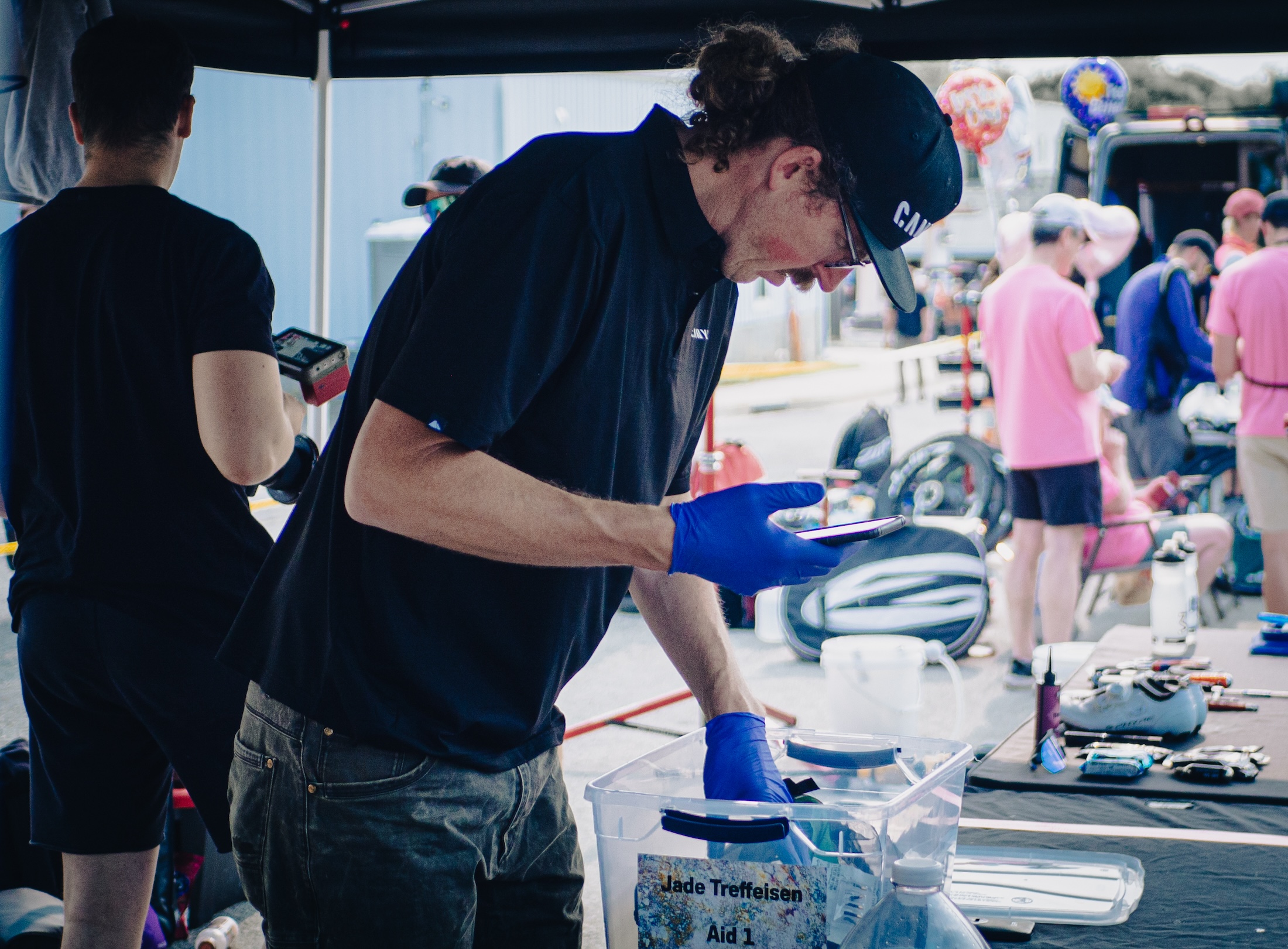 Big Tall Wayne prepares equipment for Canyon rider Jade Treffeisen, who stopped at checkpoint #1 in Alma