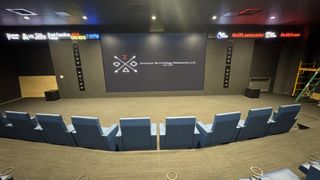 The massive video wall in the theater at a pickleball venue. 