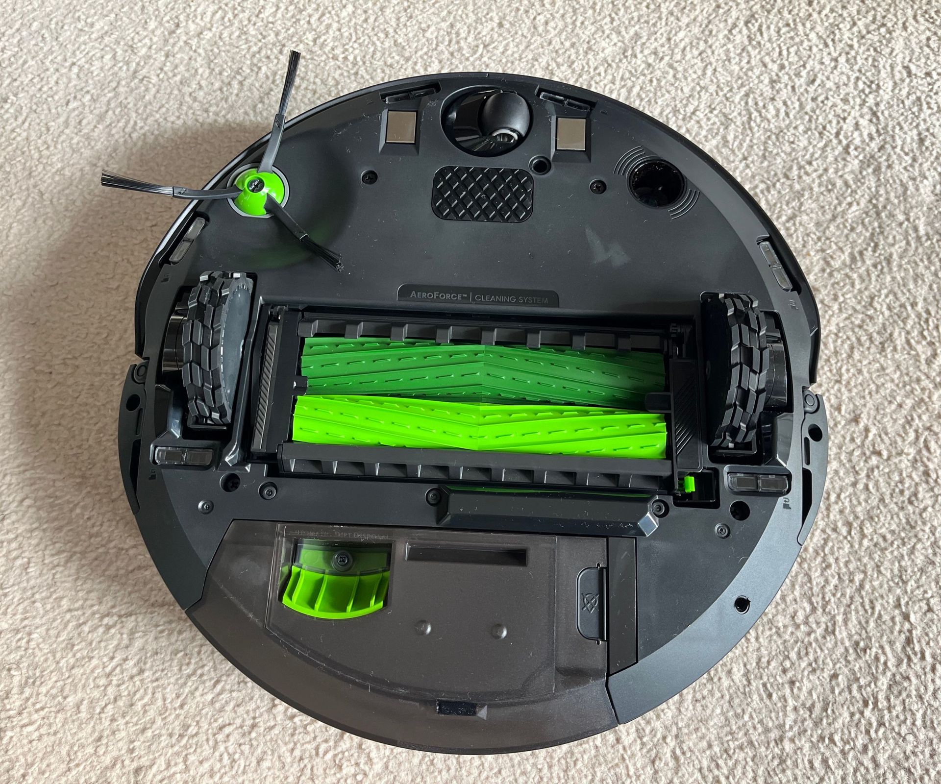 Underside of the iRobot Roomba j9+ Combo revealing rollers and brush arms