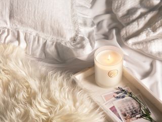 Ardere Candle on a tray by a faux fur blanket