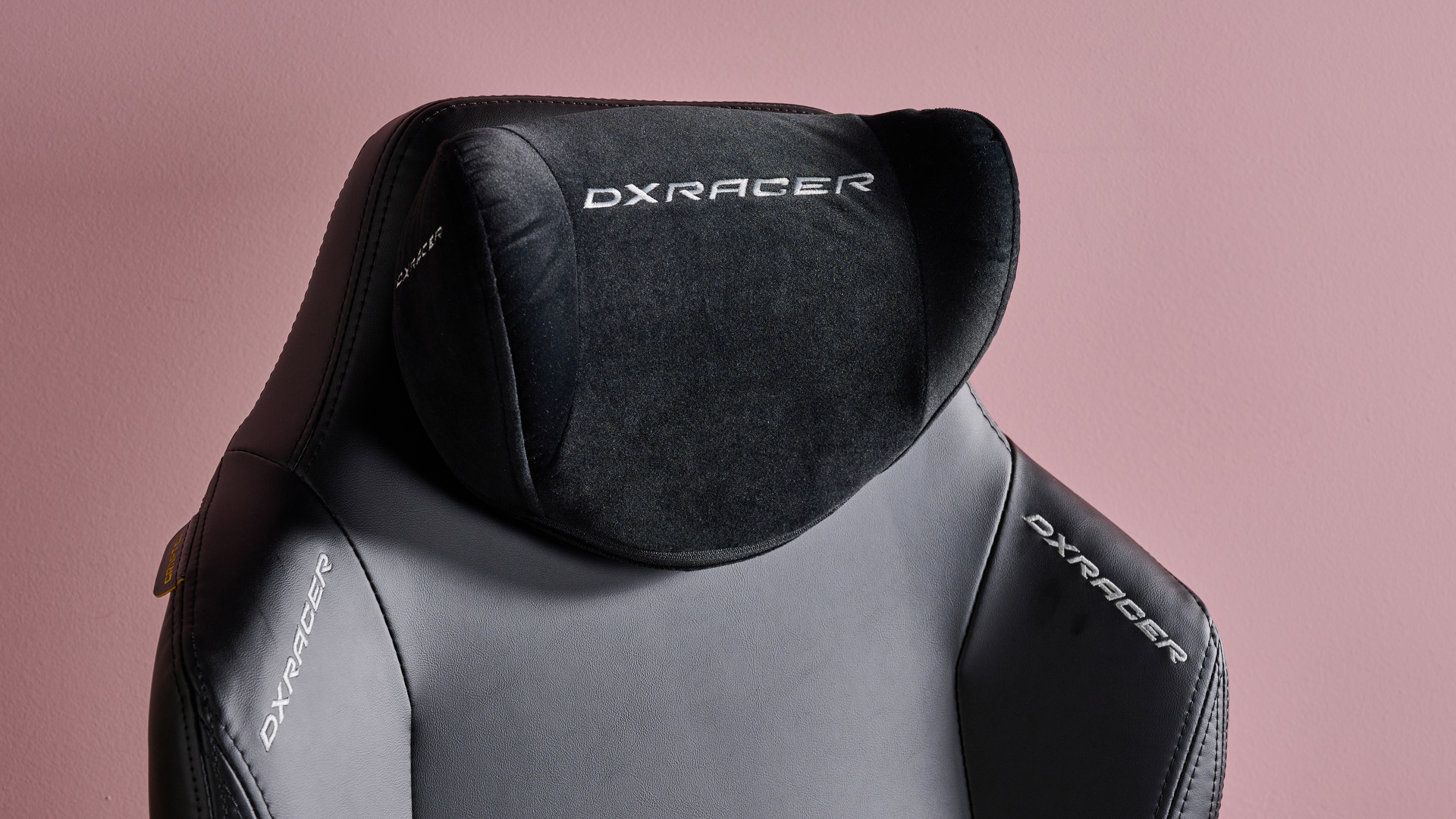 Close-up of head pillow on DXRacer Craft on pink background