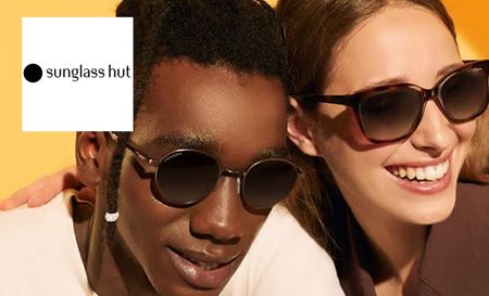 Two models posing with sunglass hut glasses