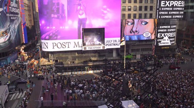 Post Malone does a surprise concert inside a LED billboard in Times Square.