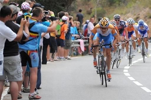 The peloton on a rainy stage six.