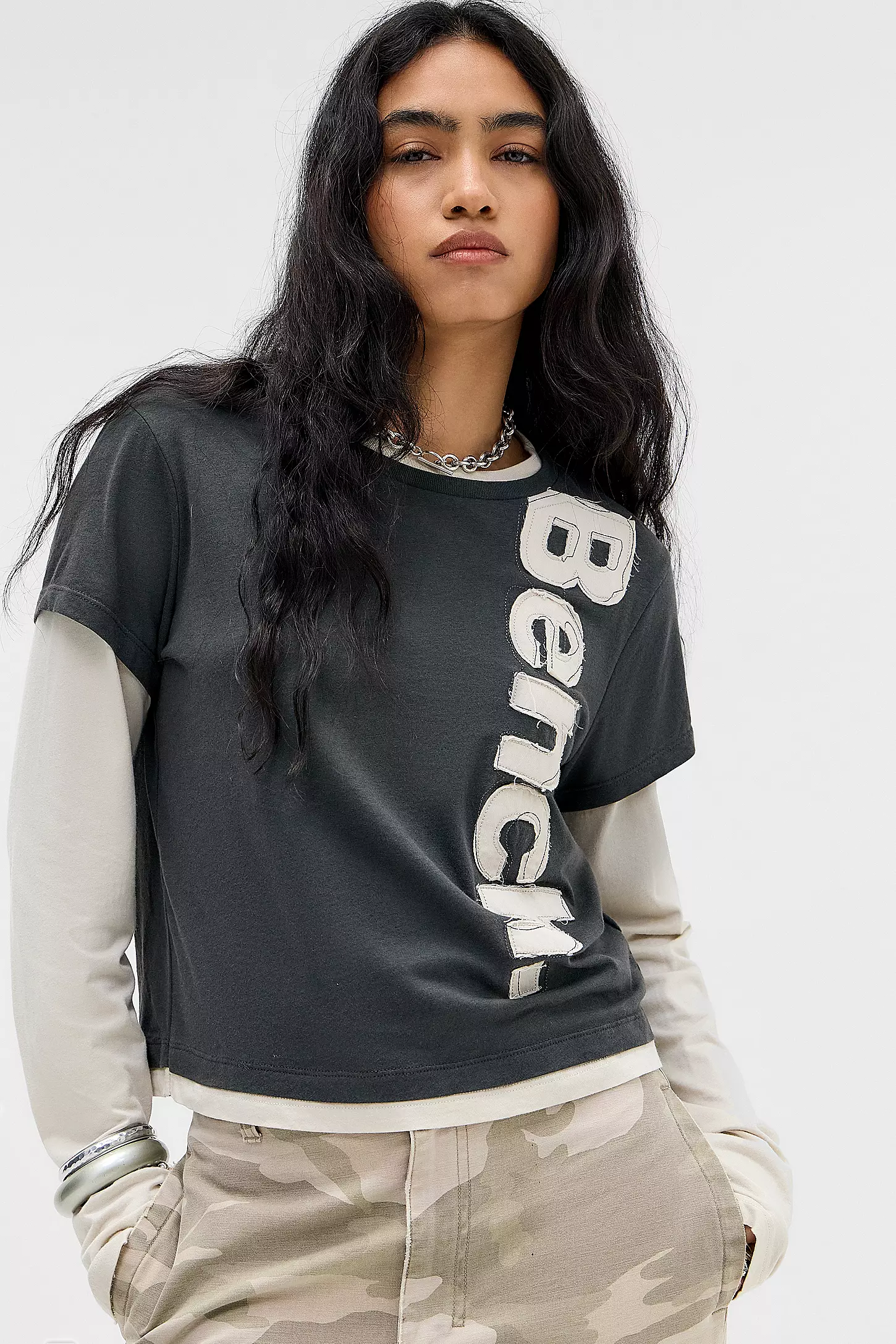 A model wears a Bench layered long sleeve t-shirt from Urban Outfitters.