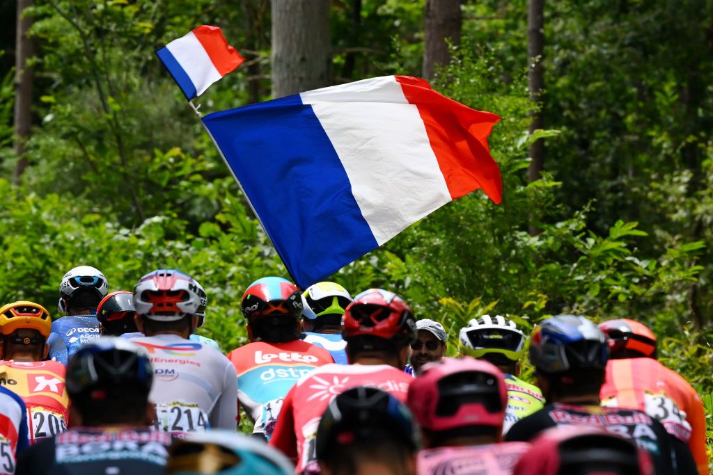 SAINTAMANDMONTROND FRANCE JULY 09 French flag and the peloton during the 111th Tour de France 2024 Stage 10 a 1873km stage from Orleans to SaintAmandMontrond UCIWT on July 09 2024 in Orleans France Photo by Dario BelingheriGetty Images