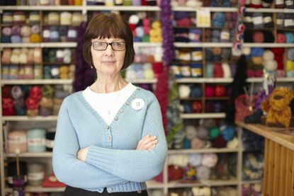 Needlecraft store owner in her shop