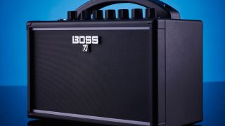 A Boss Katana-Mini guitar amp on a blue backdrop