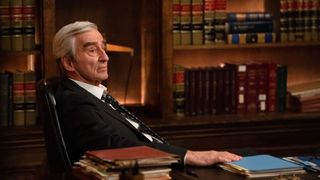 Sam Waterston as District Attorney Jack McCoy sitting in his office on Law & Order