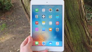 Apple iPad mini 4 in hand