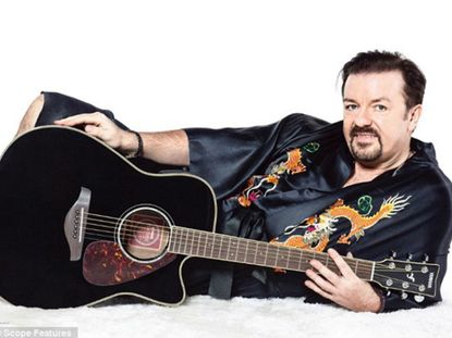 David Brent with a guitar