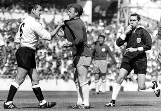 Tottenham's Dave Mackay grabs Leeds United's Billy Bremner by the shirt during a match at White Hart Lane in August 1966.