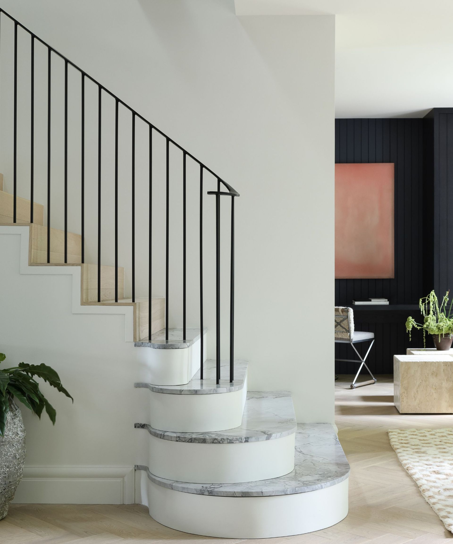 stairway with white walls and view to study