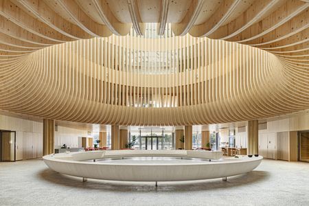 the wooden round structured lobby at timber hotel Solo Sokos Pier 4 in helsinki