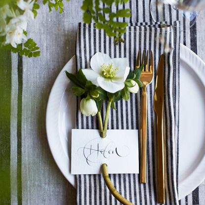 dining table with plate and spoon with flower