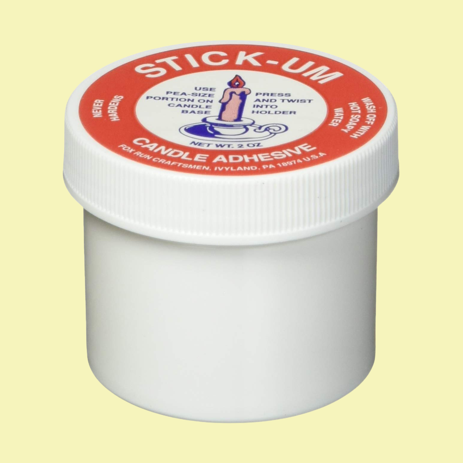 A tub of candle adhesive