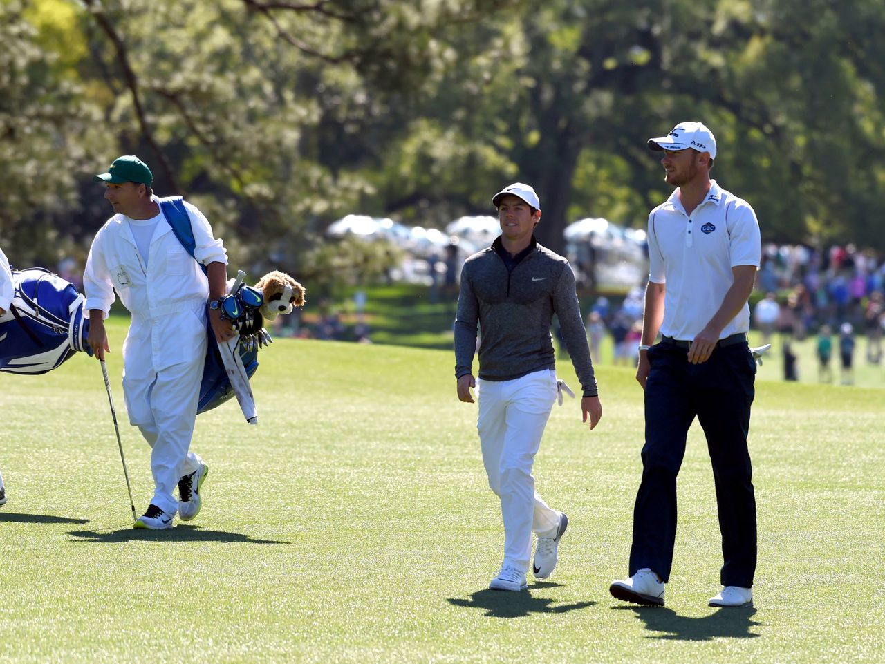 Rory McIlroy walks with Chris Wood