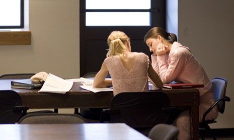 A student is tutored in a university library: Princeton Review&amp;#039;s premiere one-on-one test prep tutors cost $450 per hour.