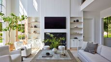 double height family living room with white walls