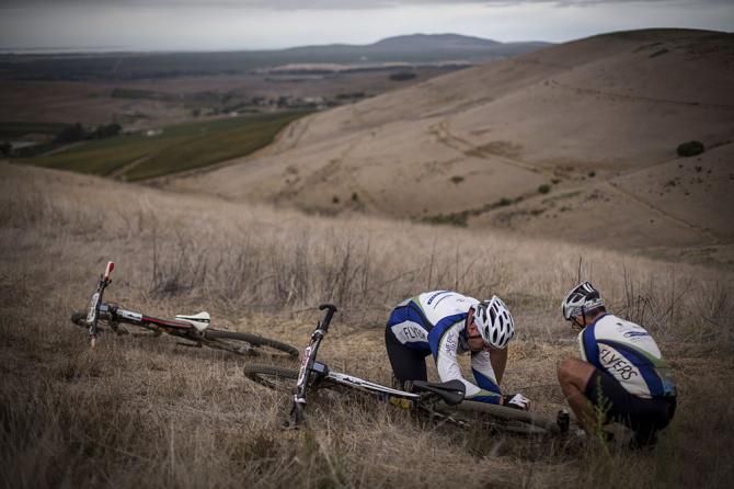 Riders fix a broken chain