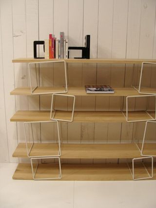 Five wood shelves from the floor and up.
