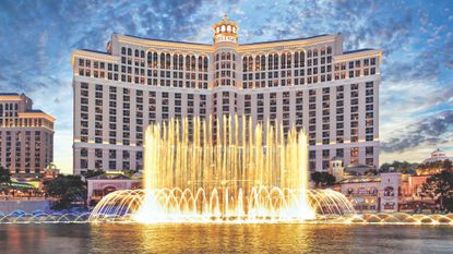 The front exterior of Bellagio Las Vegas with the fountains on