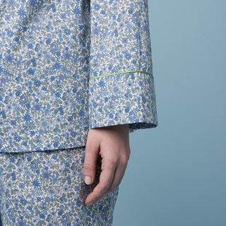 A floral pajama set in blue, white, and green hues.